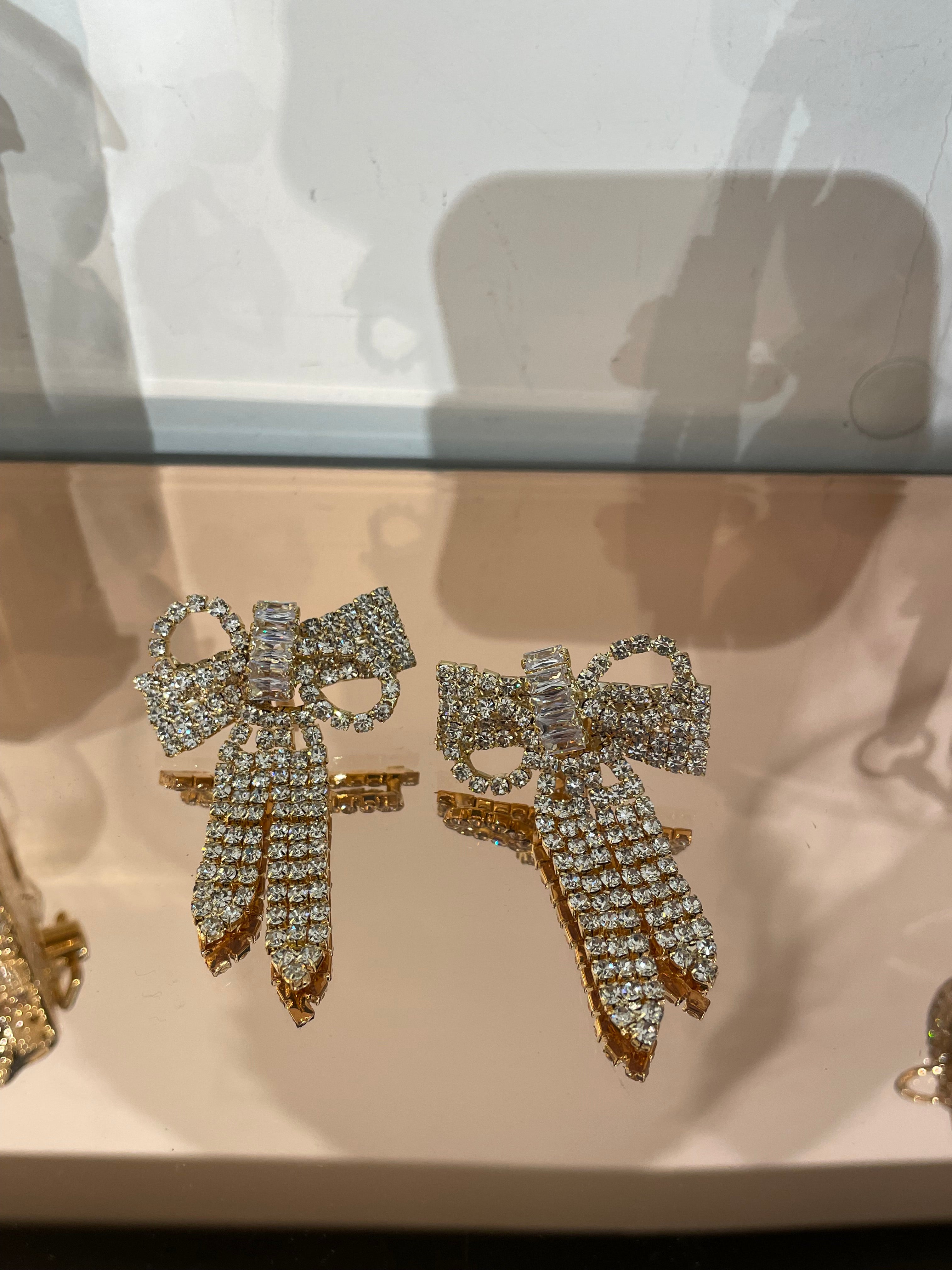 Sparkle asymmetric bow earrings