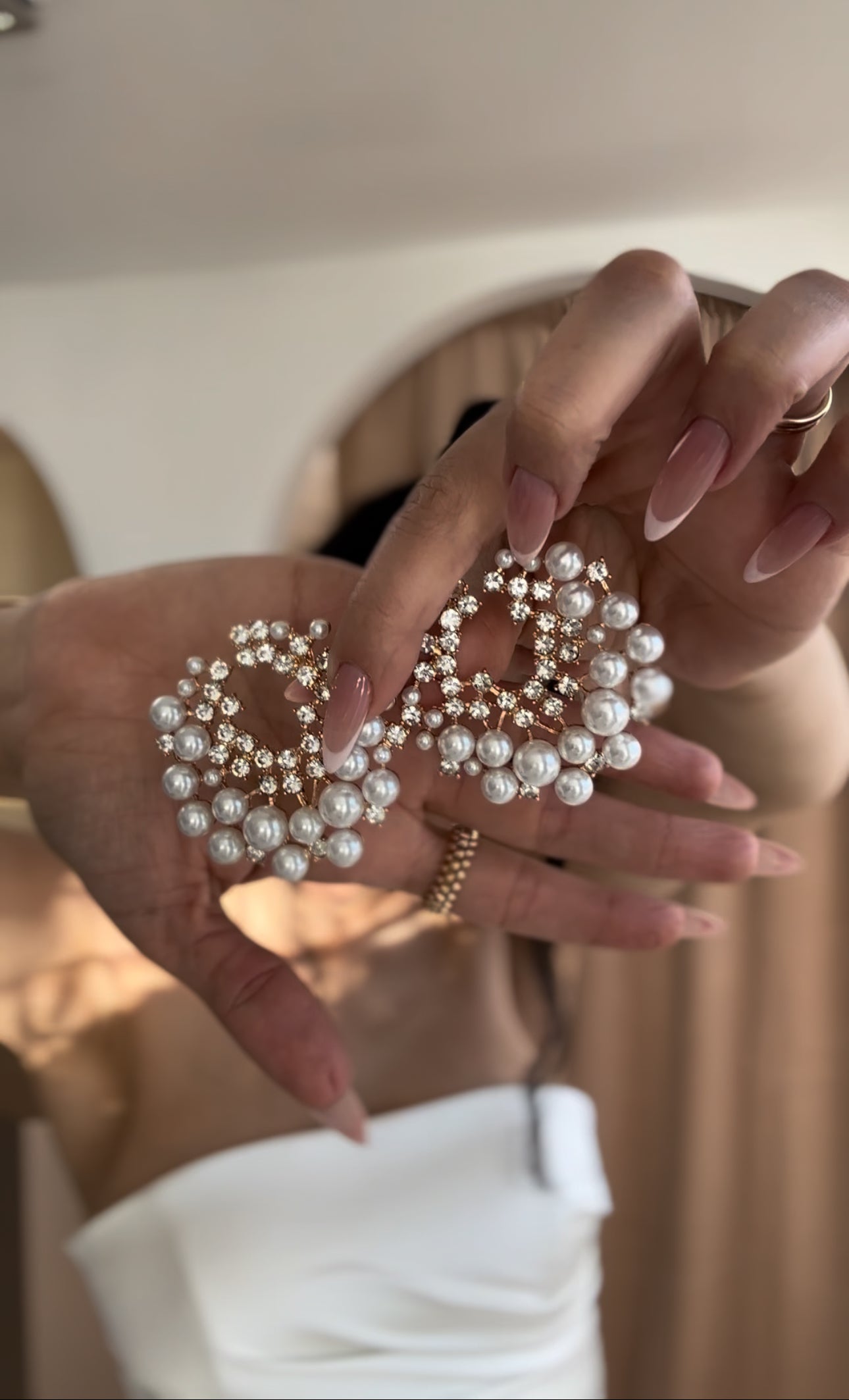 “Pearl perfection” asymmetric bow earrings